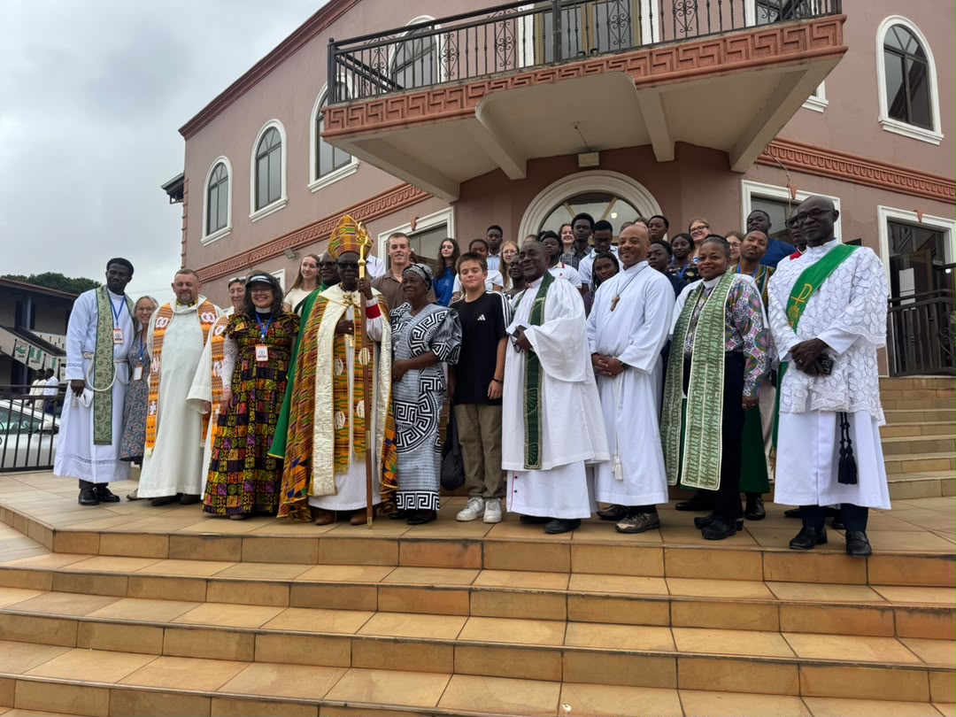Anglican clergy and leaders gather outside a church in Ghana