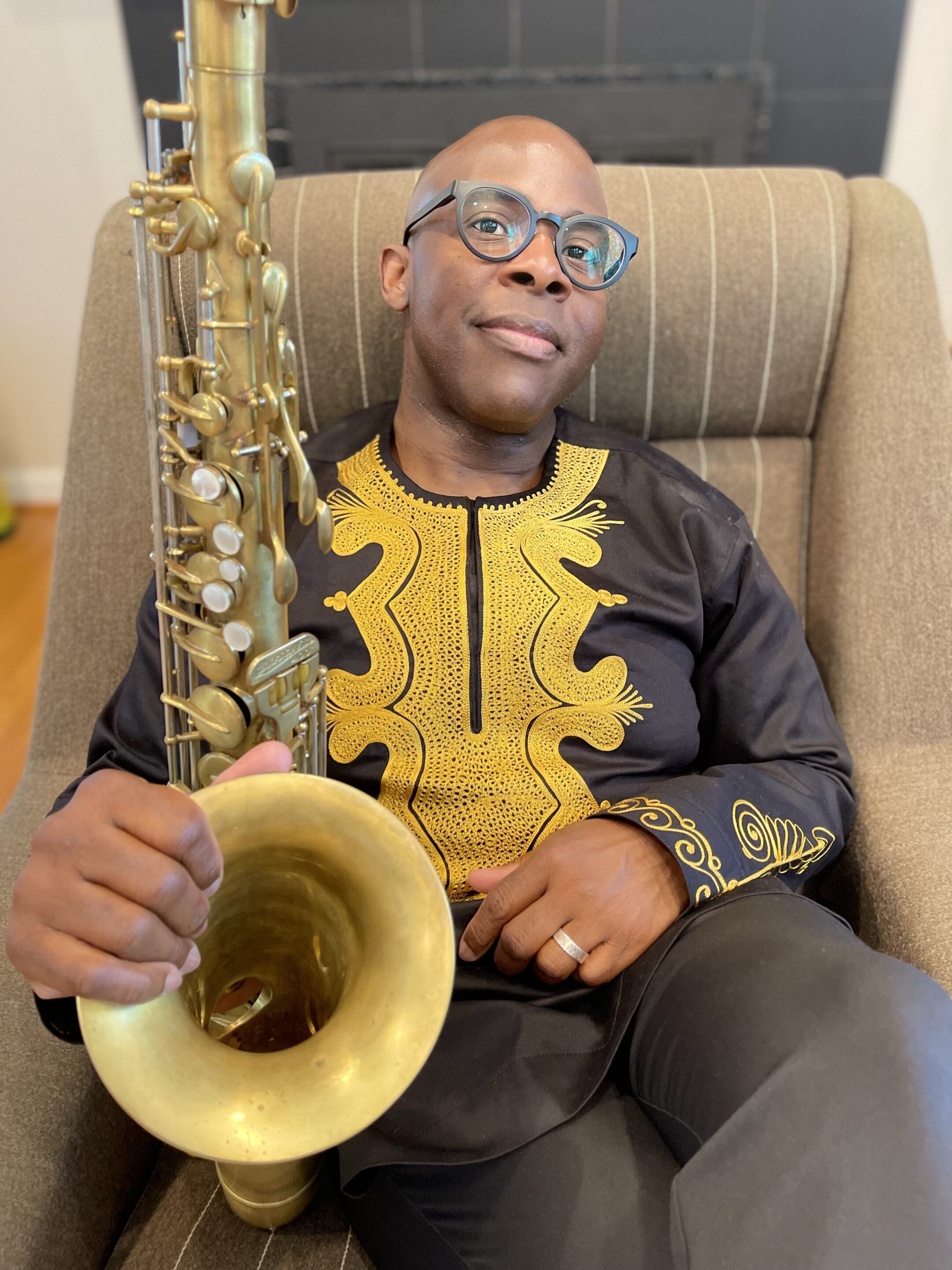 Vaughn Ambrose holding his saxophone