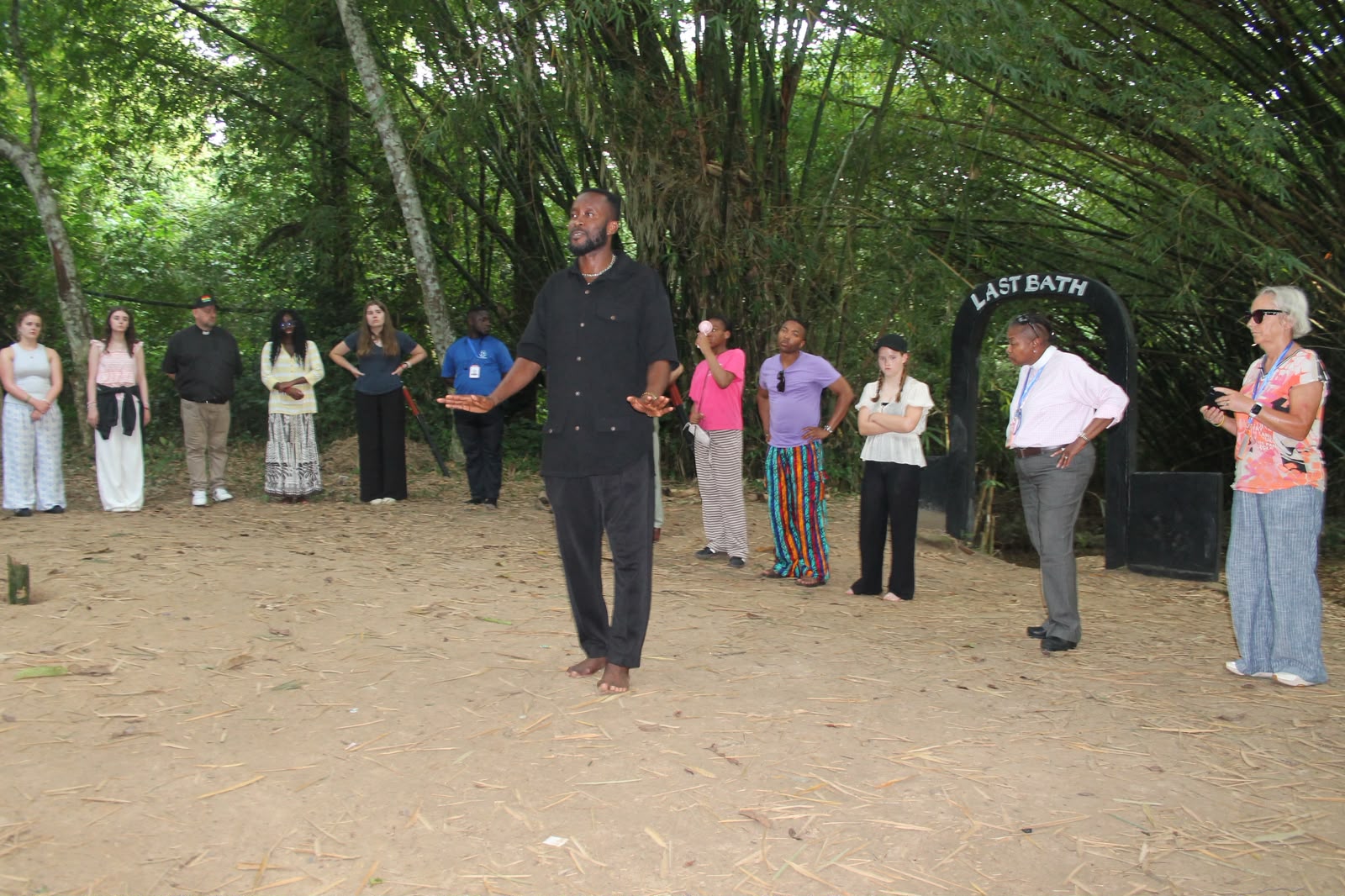 Dr. J. Lee Hill Jr. speaks with pilgrims at the Assin Manso Last Bath site in Ghana