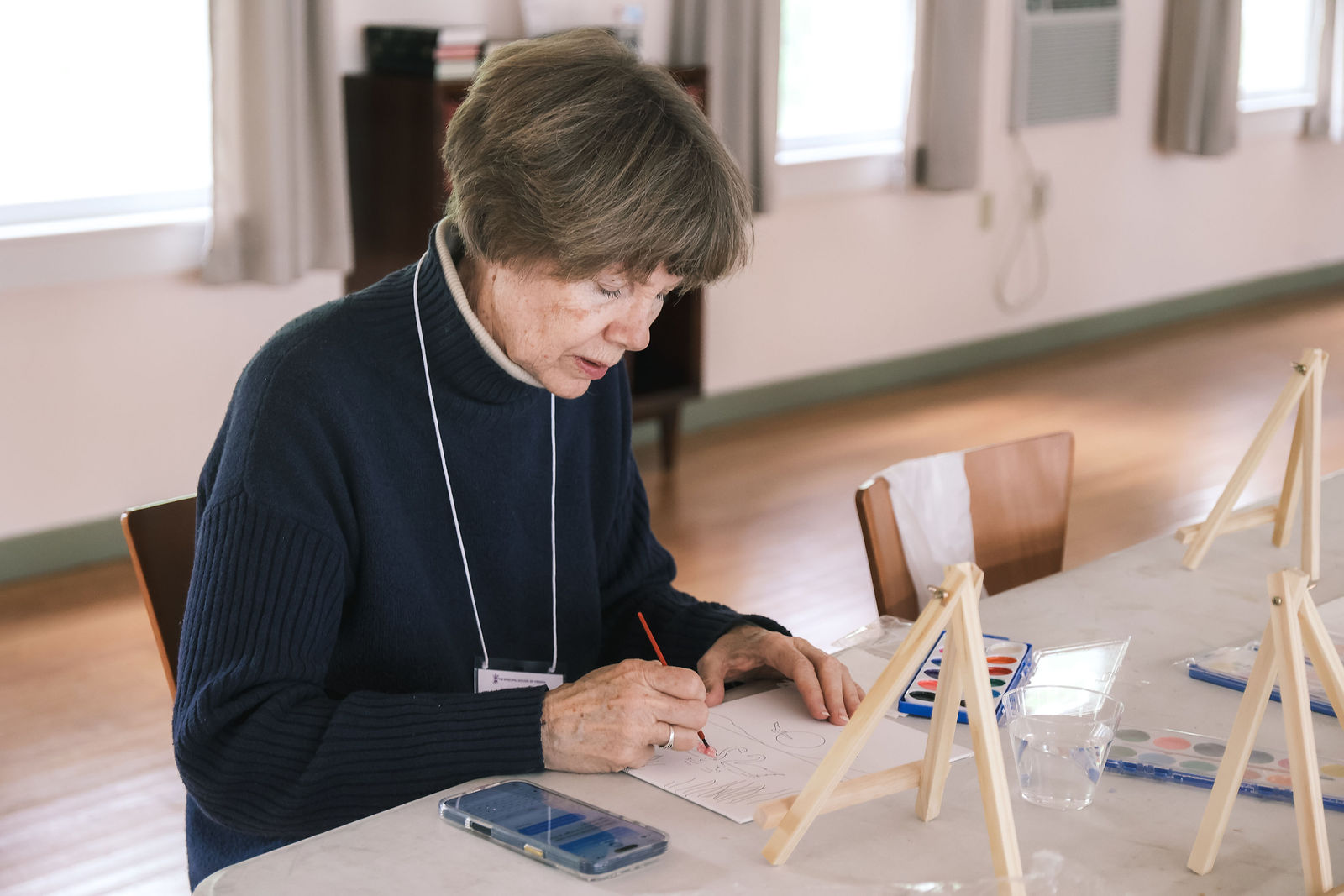 A clergy participant journaling during a reflective activity at the retreat