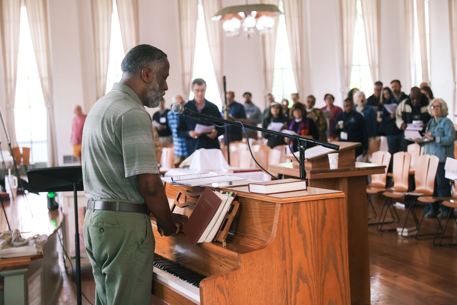 Clergy singing together during worship at the Spring Clergy Retreat