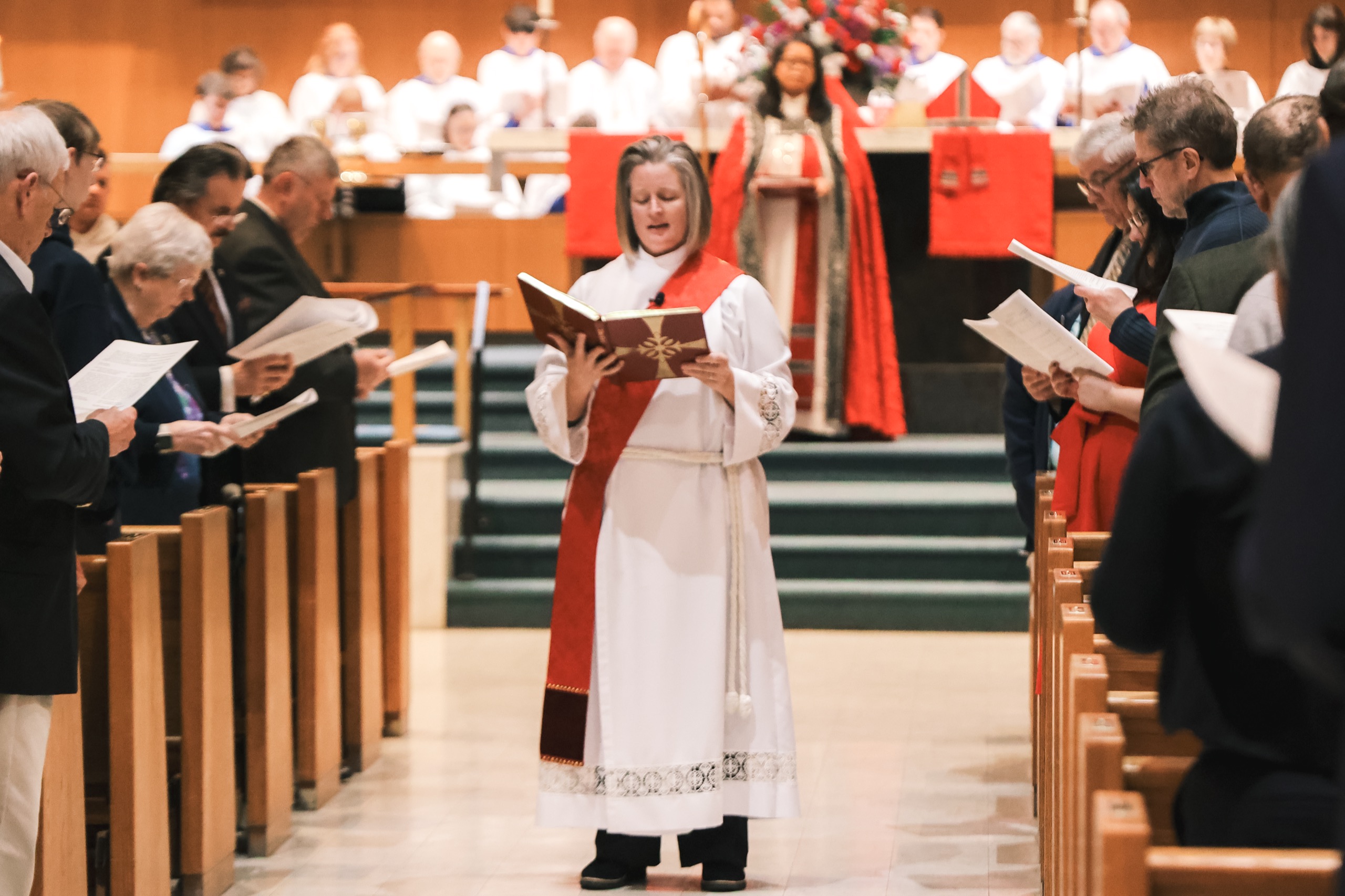 The Ven. Holly Hanback reads the Gospel during a service.