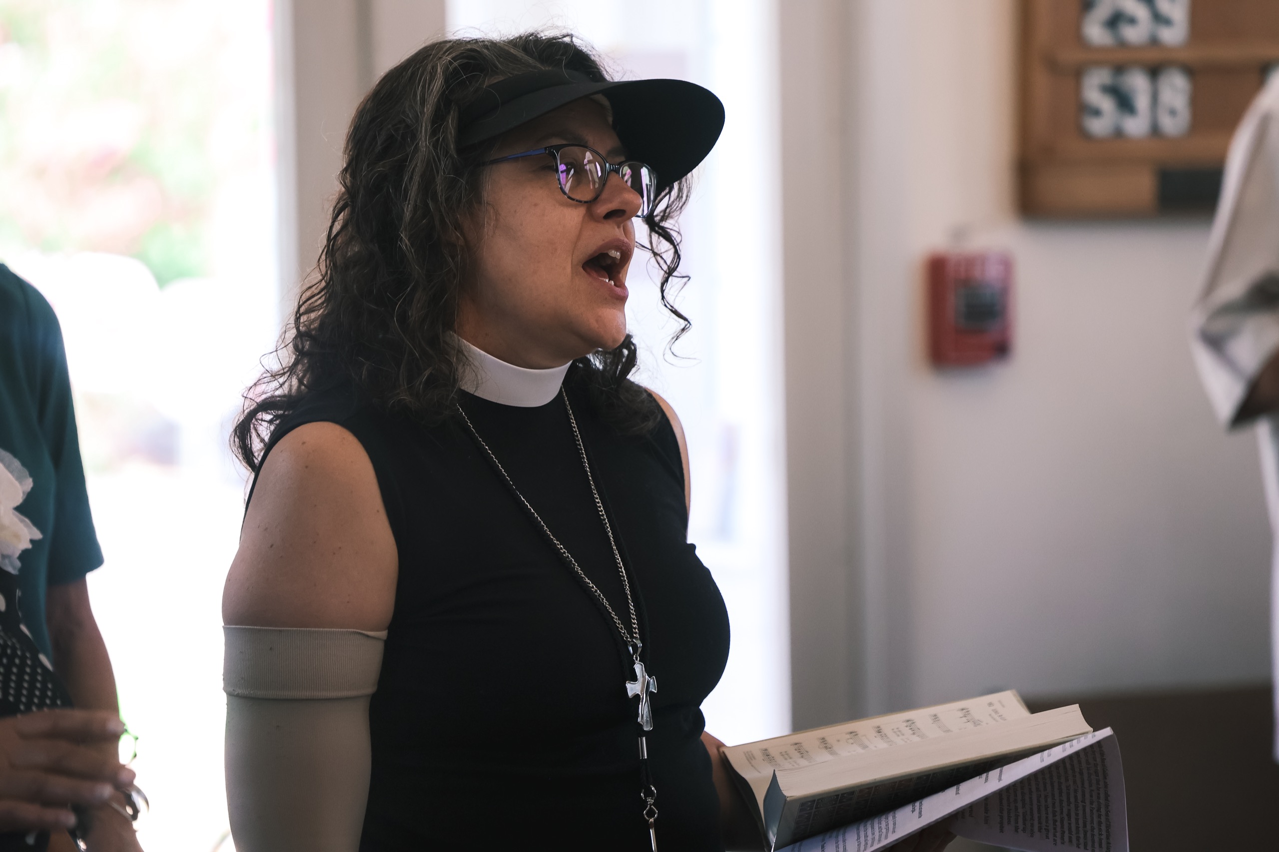 The Ven. Susie Harding sings during a service.