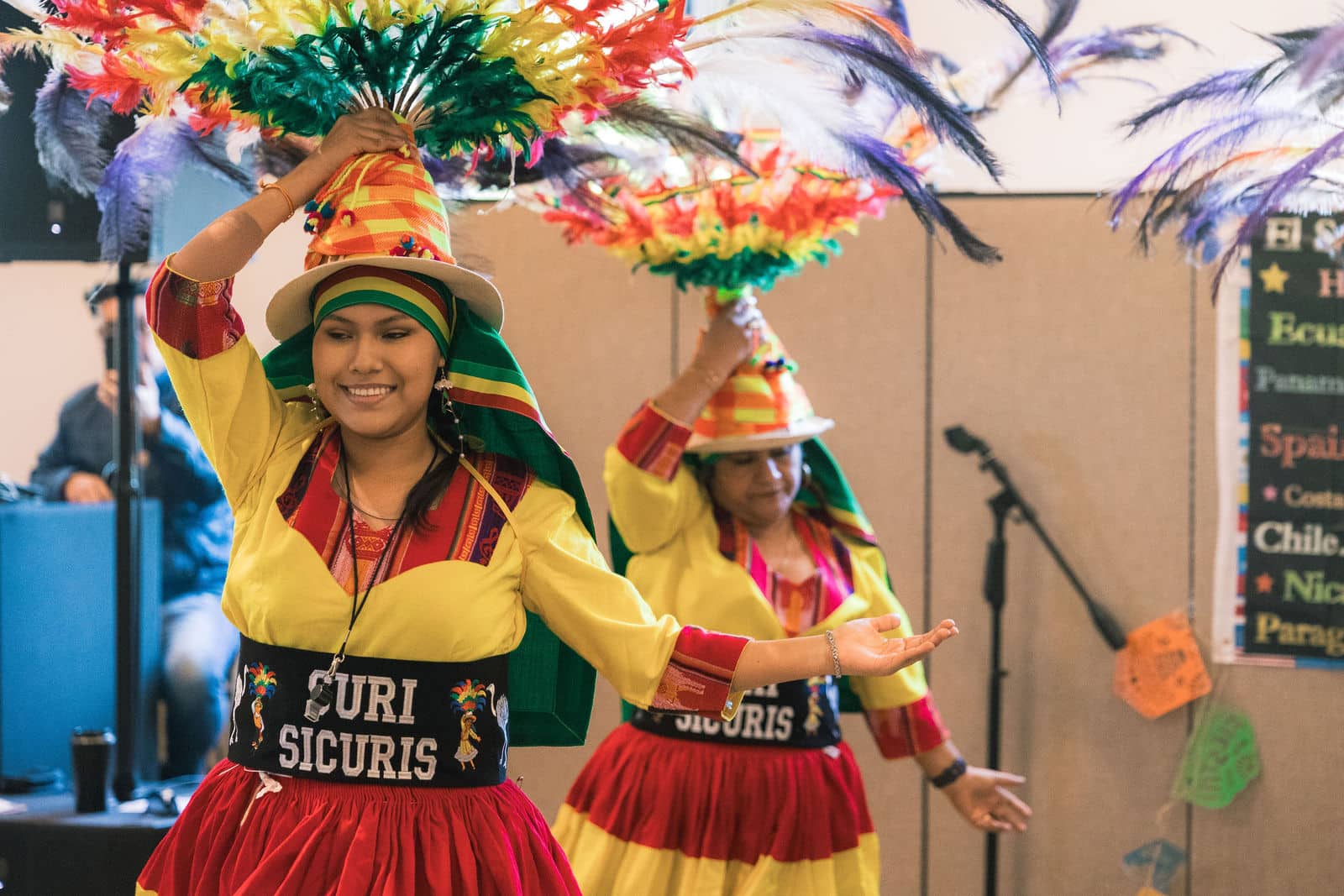 Festival dancers performing in feathered headdresses