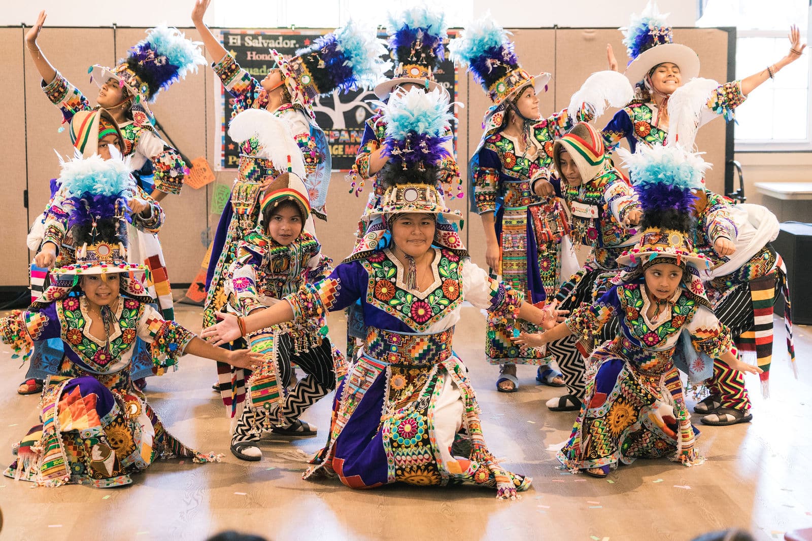Festival performers in colorful traditional costumes