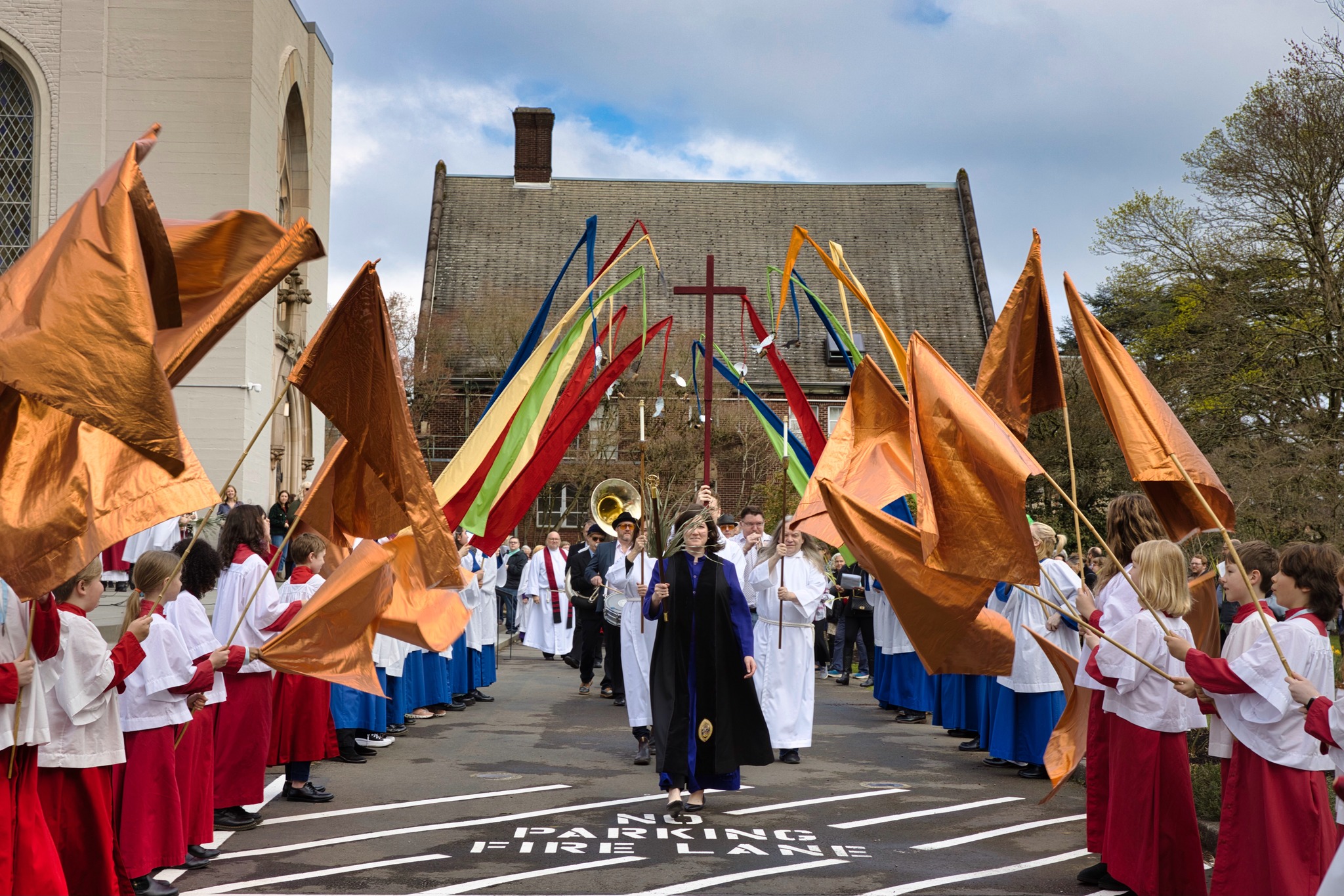 Children and adults take part in a colorful procession as part of intergenerational worship.