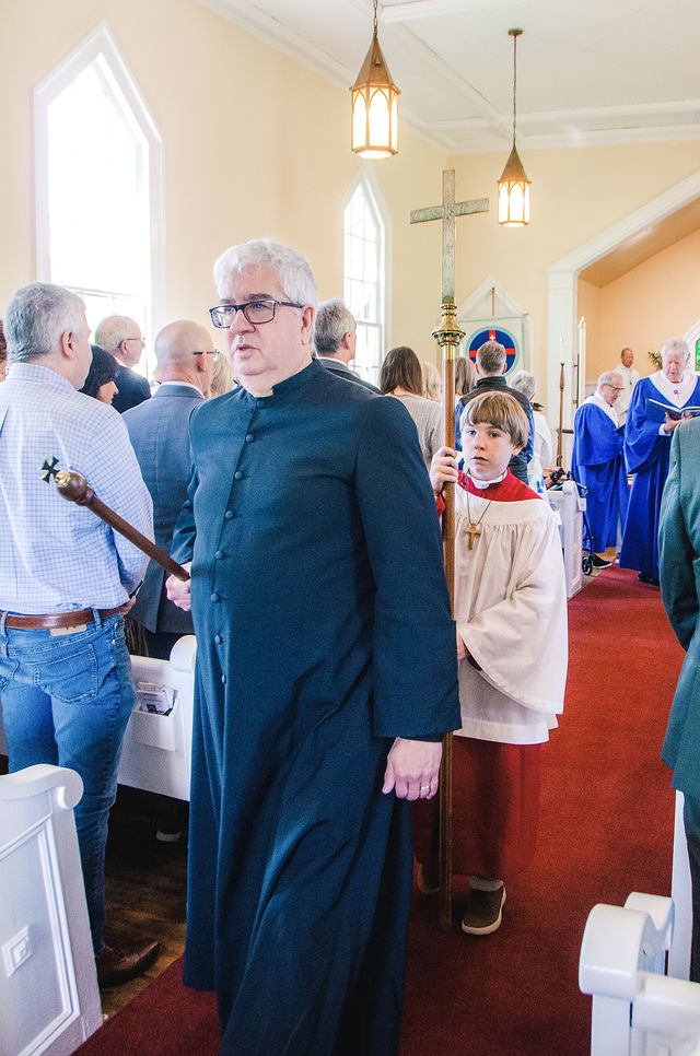 Members of Grace Episcopal Church stand in the sanctuary during the anniversary service.