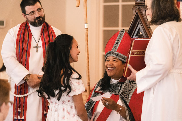 Bishop Gayle E. Harris smiles with a young parishioner during Varina Episcopal Church’s centennial celebration.