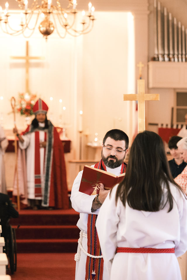 The Rev. Dr. Bart A. Natoli leads part of the Varina Episcopal Church centennial service.