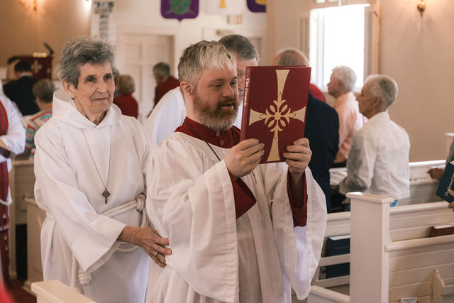 Clergy process through the sanctuary during Varina Episcopal Church’s centennial service.